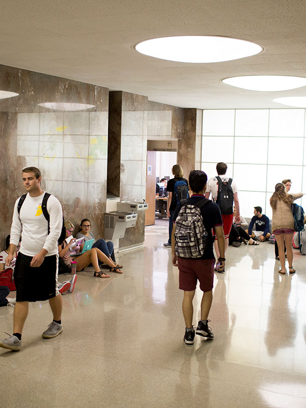 The main lobby in Ballantine Hall, crowded with students.